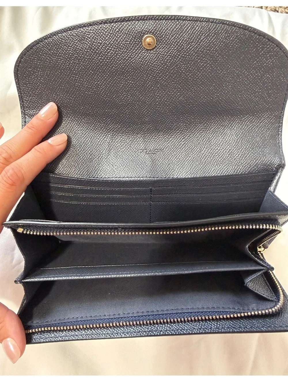 Coach Navy Leather Wallet with Multiple Card Slots and Zippered Compartments